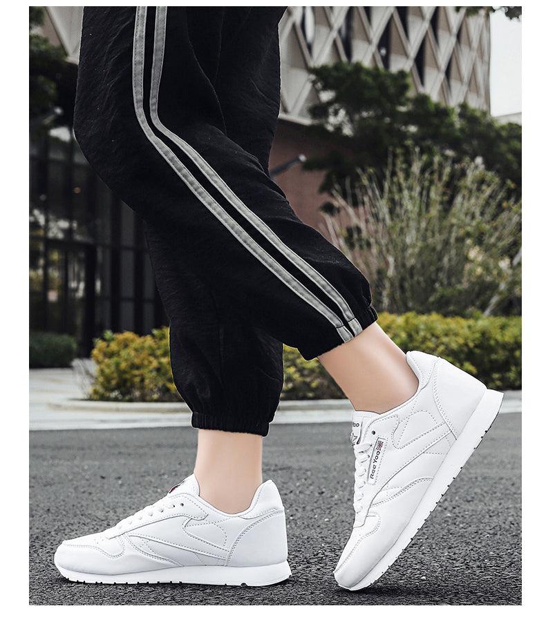 White leather Stevvex sneakers pair with lace-up design, worn with black joggers on city street on Tampa Home & Garden Store