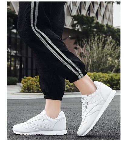 White leather Stevvex sneakers pair with lace-up design, worn with black joggers on city street on Tampa Home & Garden Store