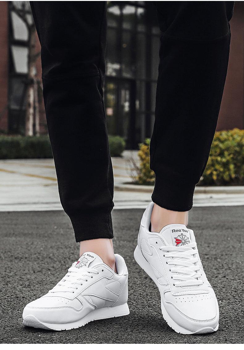 Stevvex white leather sneakers with lace-up design, clean panels pair on pavement on Tampa Home & Garden Store