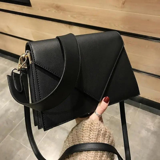 Stevvex black PU leather crossbody bag with structured geometric flap and adjustable strap on Tampa Home & Garden Store