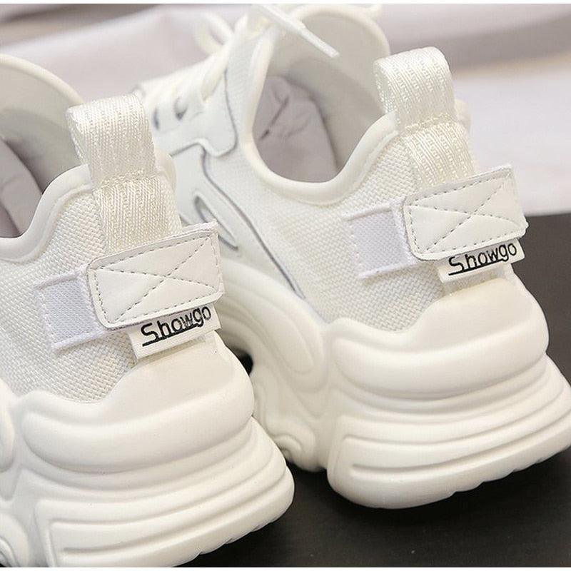 White women's sneakers with a thick platform sole, lace-up mesh upper, Showgo label on Tampa Home & Garden Store