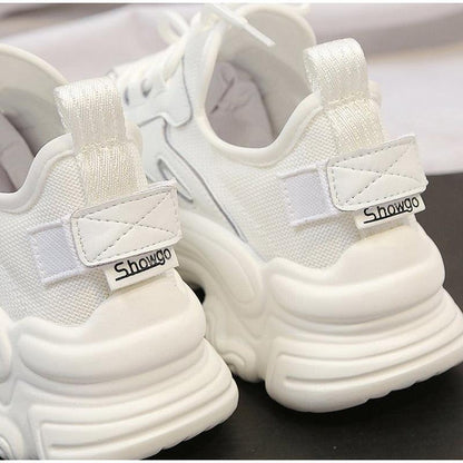 White women's sneakers with a thick platform sole, lace-up mesh upper, Showgo label on Tampa Home & Garden Store