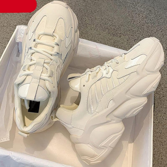 Pair of Stevvex white sneakers with chunky platform sole, leather, lace-up walking shoes on Tampa Home & Garden Store