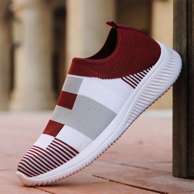 Slip-on knitted women's sneakers with red upper and white-gray colorblock pattern, white sole on Tampa Home & Garden Store