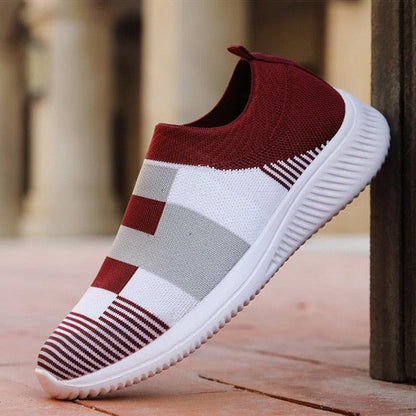Slip-on knitted women's sneakers with red upper and white-gray colorblock pattern, white sole on Tampa Home & Garden Store