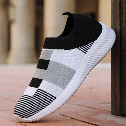 Stevvex womens knitted slip-on sneaker with black upper and white-gray striped knit on Tampa Home & Garden Store