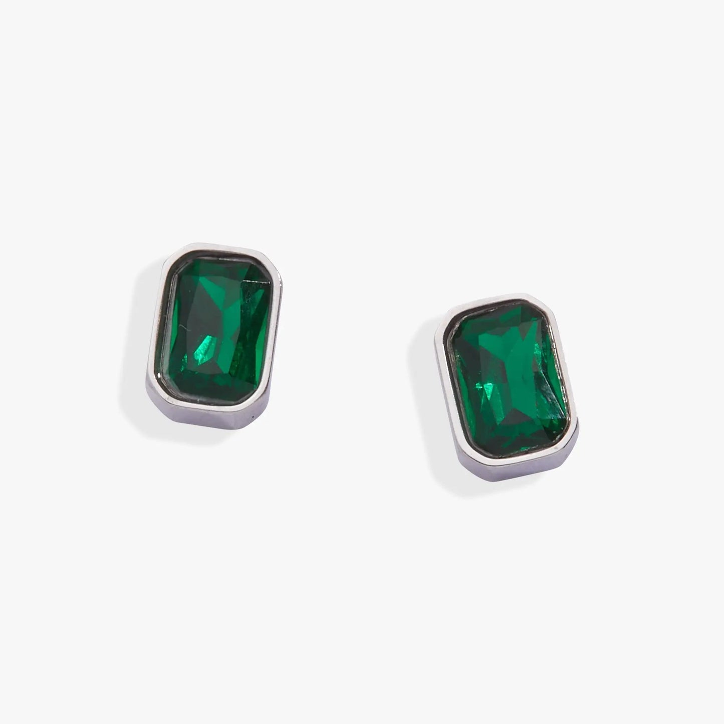 Pair of emerald-cut May birthstone stud earrings in silver bezel setting by Alex and Ani on Tampa Home & Garden Store