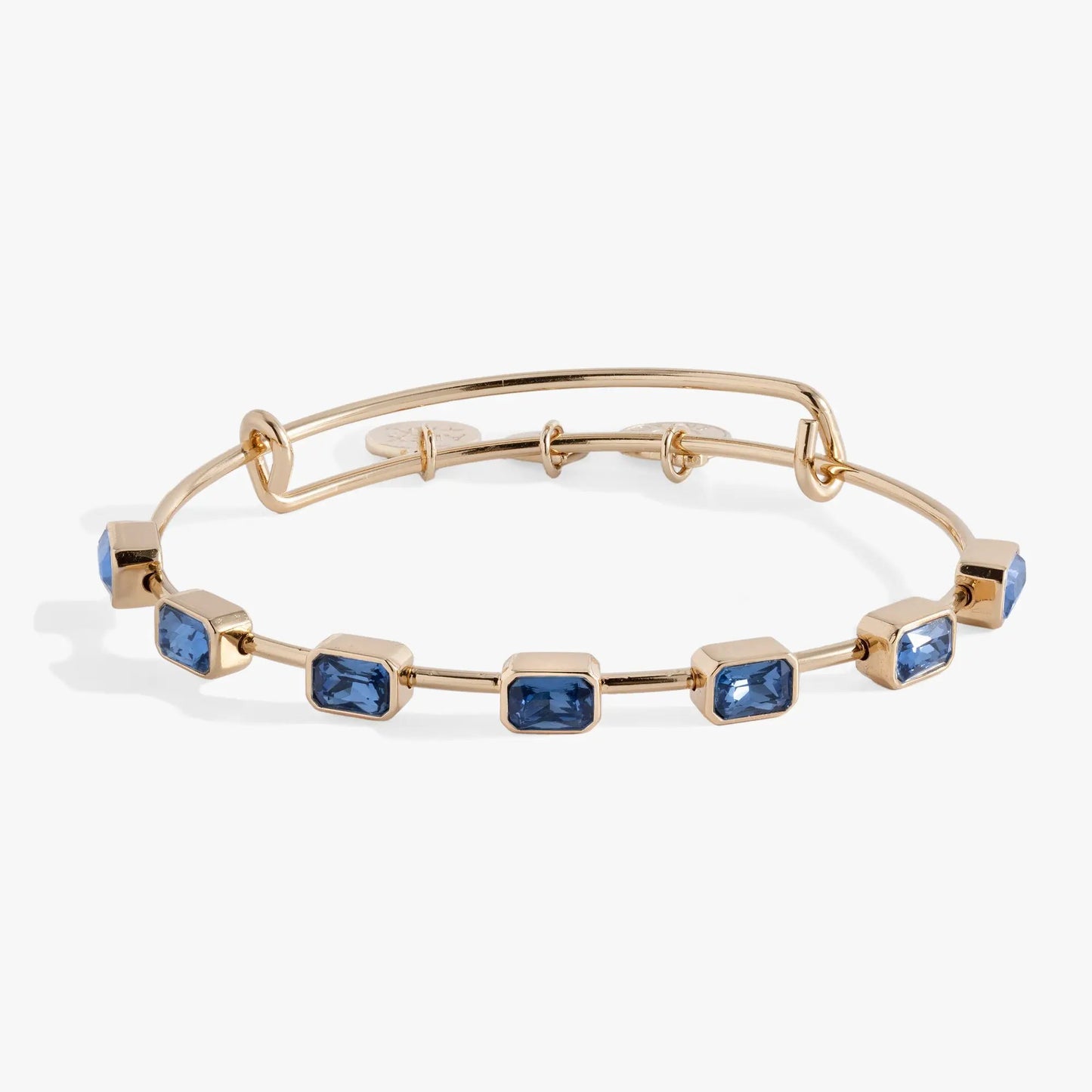September Birthstone Emerald Cut Bangle by Alex Ani with blue stones on gold-tone bracelet on Tampa Home & Garden Store