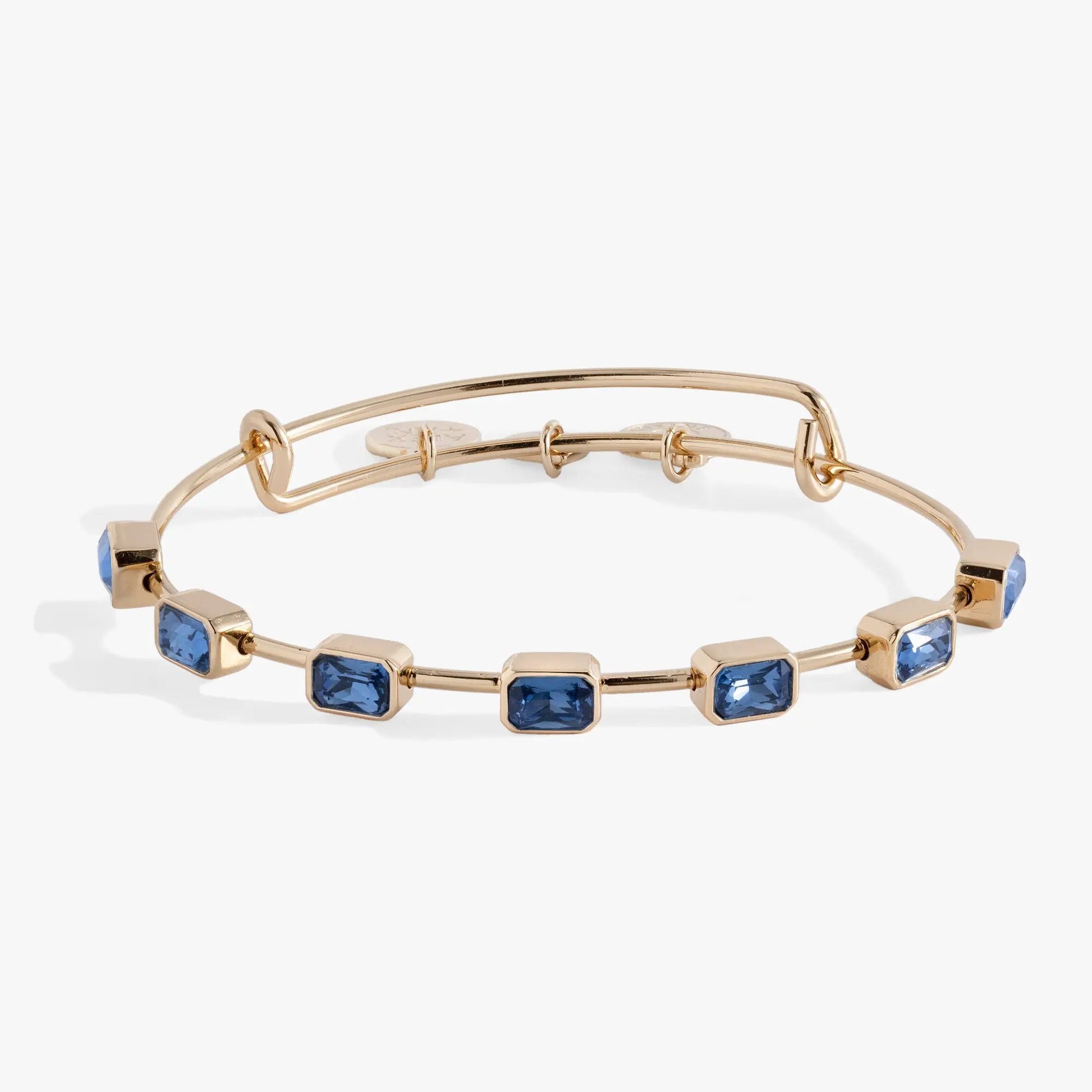 September Birthstone Emerald Cut Bangle by Alex Ani with blue stones on gold-tone bracelet on Tampa Home & Garden Store