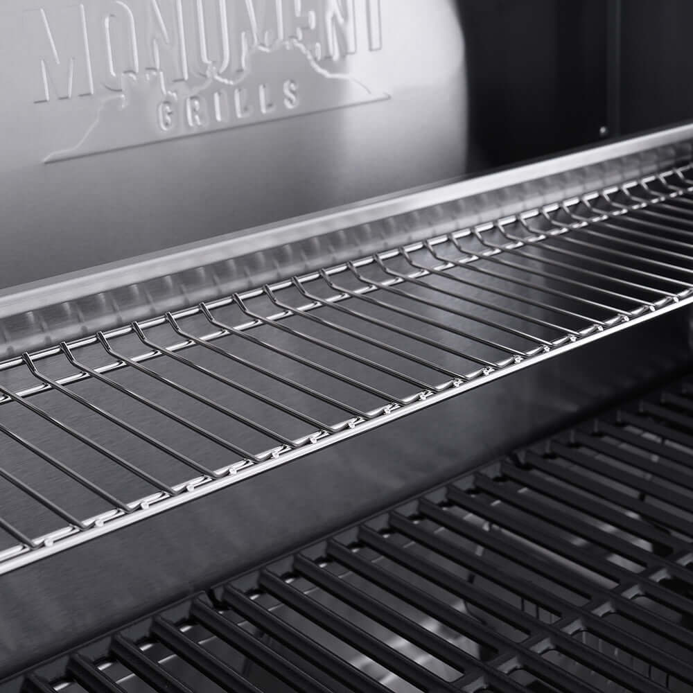 Eminence 405 Clearview stainless gas grill close-up rack with Monument Grills logo on Tampa Home & Garden Store