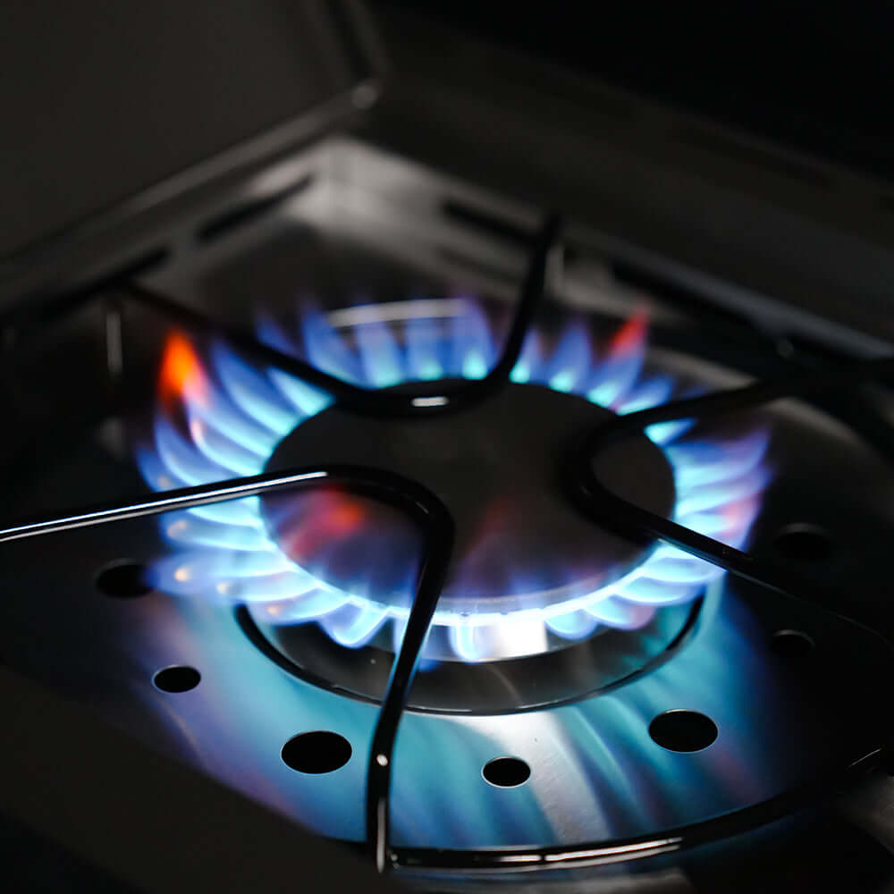 Eminence 425 6-burner Monument Grills outdoor propane grill burner lit with blue flames on Tampa Home & Garden Store