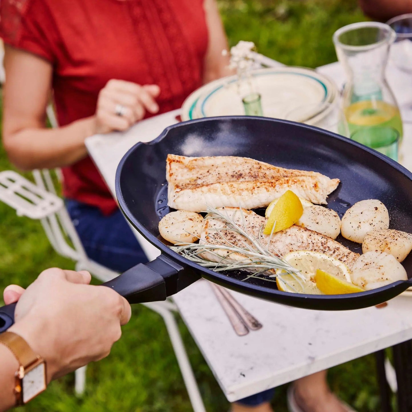 Alva Ceramic Nonstick Fish Pan with seared fillets and lemon wedges on Tampa Home & Garden Store