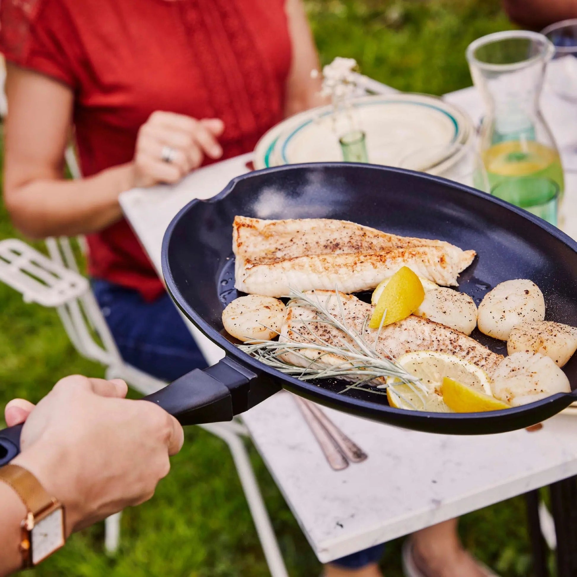 Alva Ceramic Nonstick Fish Pan with seared fillets and lemon wedges on Tampa Home & Garden Store