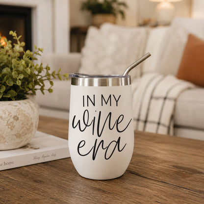 Gia Roma Wine Era 17oz tumbler white with black script, stainless lid and straw on wood table on Tampa Home & Garden Store