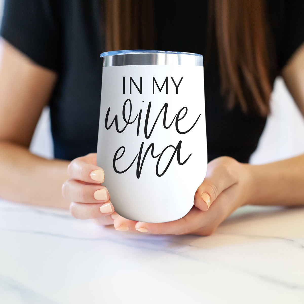 Wine Era 17oz tumbler Gia Roma, white with black script in my wine era, held by hands on Tampa Home & Garden Store