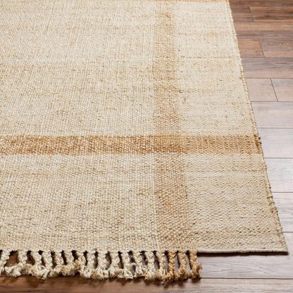 Errin Jute Area Rug natural beige with fringed edge on wood floor on Tampa Home & Garden Store