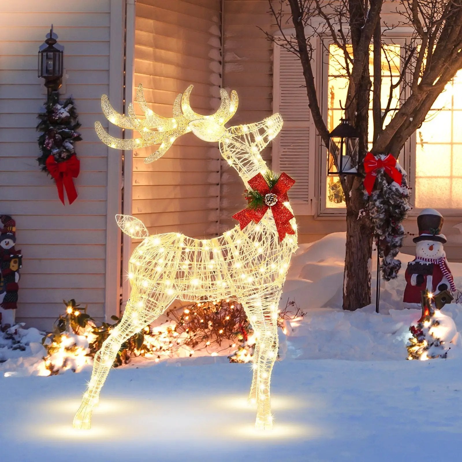 DirectDeals lighted standing reindeer with warm LEDs, red bow, pinecone accent on stakes on Tampa Home & Garden Store