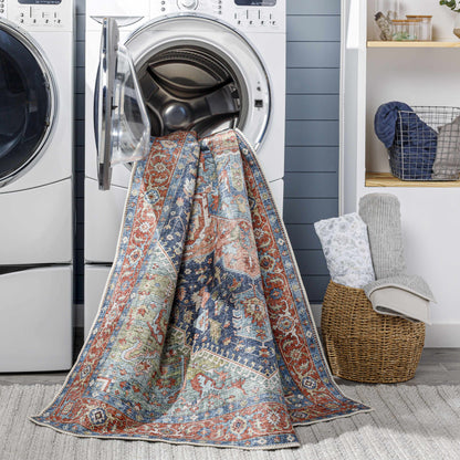 Exira Washable Area Rug by Boutique Rugs featuring red blue cream oriental motif on Tampa Home & Garden Store