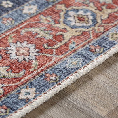 Exira washable area rug Boutique Rugs; close-up of red, blue and beige pattern with woven edge on Tampa Home & Garden Store