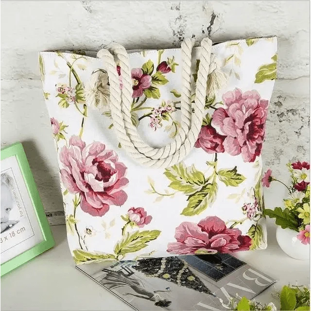 Folding floral canvas shoulder bag by Stevvex, white with pink peony print, rope handles on Tampa Home & Garden Store