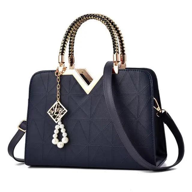Stevvex navy leather satchel with geometric quilt, studded handles, gold V lock, phone pocket on Tampa Home & Garden Store