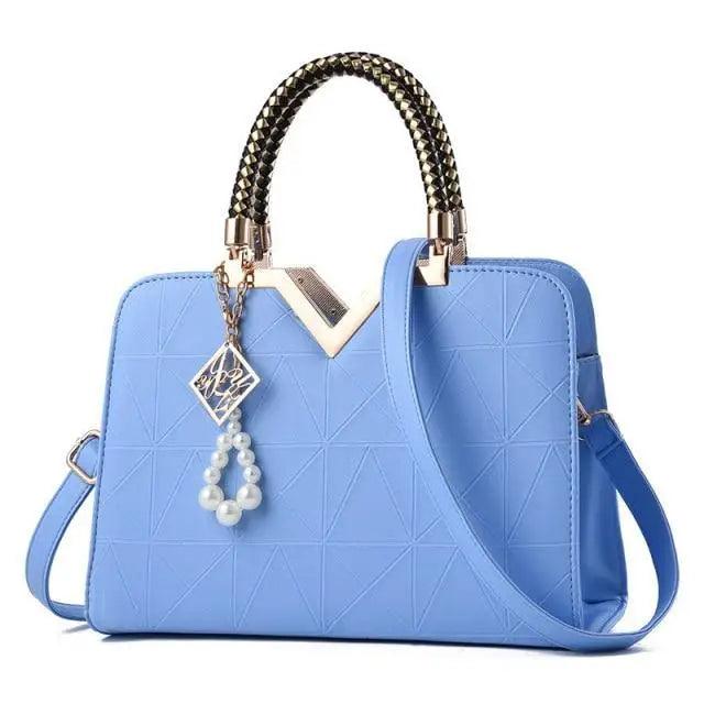 Blue Stevvex leather satchel bag with crossbody strap, quilted pattern, pearl charm on Tampa Home & Garden Store