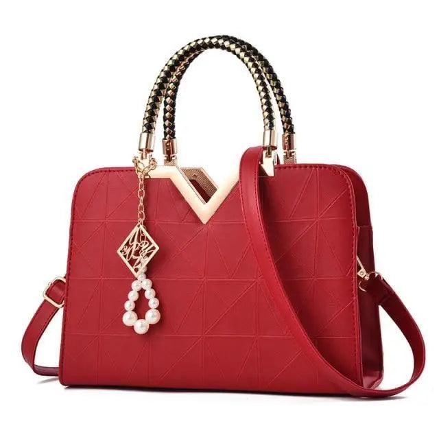 Stevvex red leather satchel bag with gold-tone hardware, top handles and pearl charm on Tampa Home & Garden Store