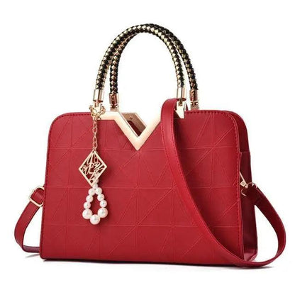 Stevvex red leather satchel bag with gold-tone hardware, top handles and pearl charm on Tampa Home & Garden Store