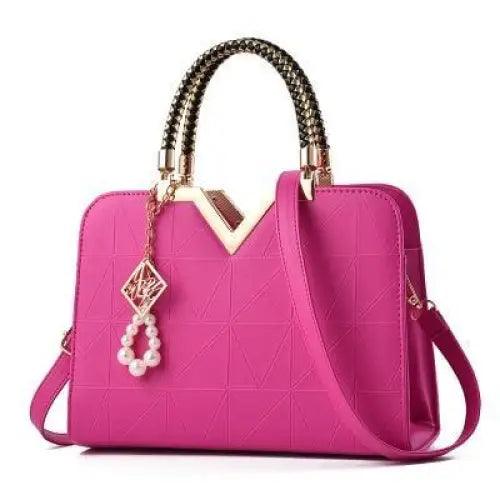 Stevvex pink leather satchel bag with gold-tone chain handles and crossbody strap on Tampa Home & Garden Store