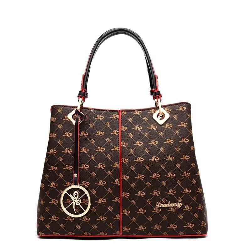 Satchel bag by Stevvex in brown monogram leather with red trim, phone pocket and handles on Tampa Home & Garden Store