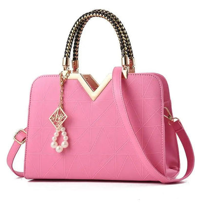Stevvex pink satchel bag with gold hardware, crossbody strap and pearl charm on Tampa Home & Garden Store