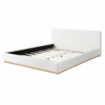 Elegant upholstered queen bed with solid wood frame in white, includes slatted base on Tampa Home & Garden Store