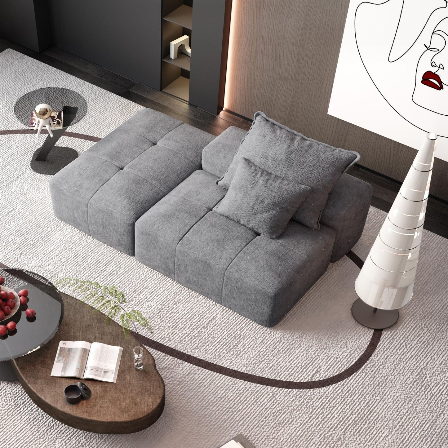 Modern oversized modular gray sectional sofa in a stylish living room with round glass coffee table on Tampa Home & Garden Store