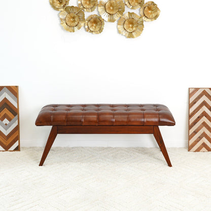 Cognac leather upholstered bench with solid dark wood frame and tufted cushion, tapered legs on Tampa Home & Garden Store