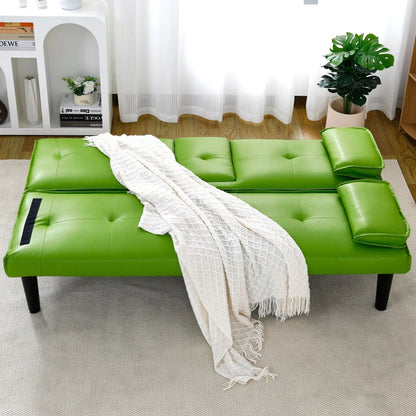 Green leather futon sofa bed with tufted cushions in a bright living room on Tampa Home & Garden Store
