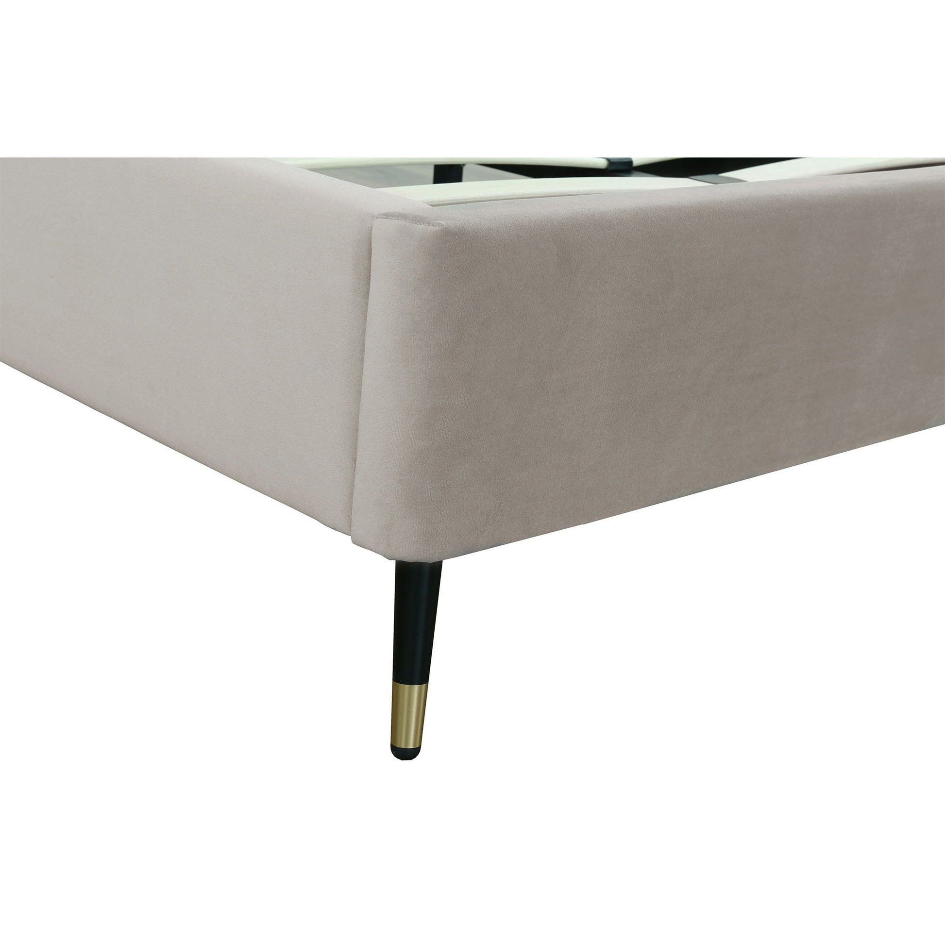 Crosby upholstered bed frame in beige fabric with black leg and brass foot slats visible on Tampa Home & Garden Store