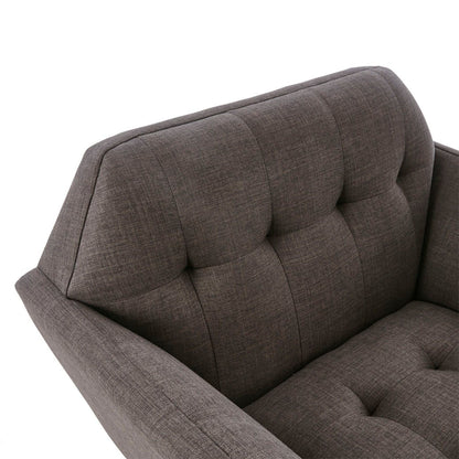 Modern lounge chair in gray textured fabric with button tufting on backrest on Tampa Home & Garden Store