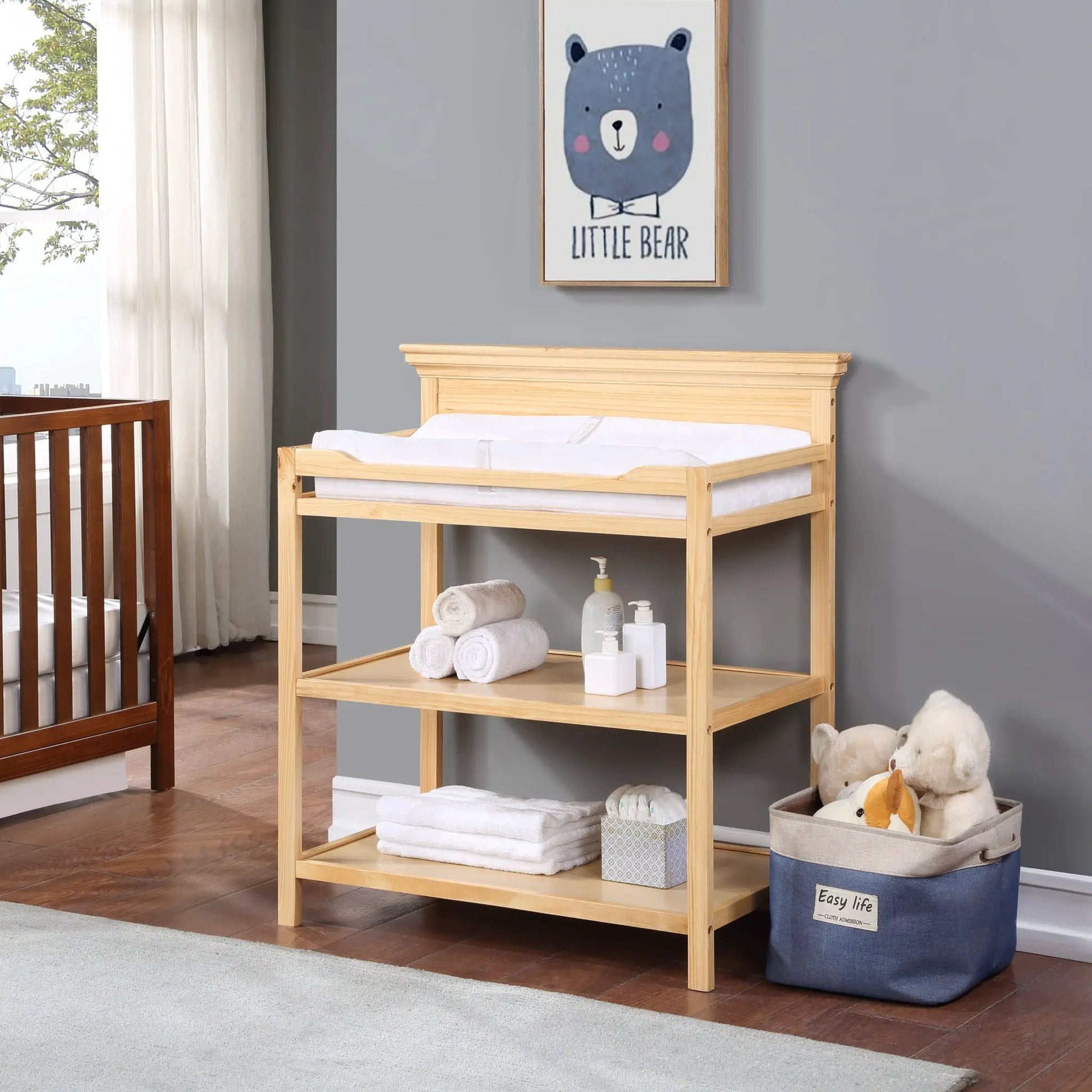 Universal Changing Table by Unique Piece Furniture in light wood with baby supplies on shelf on Tampa Home & Garden Store