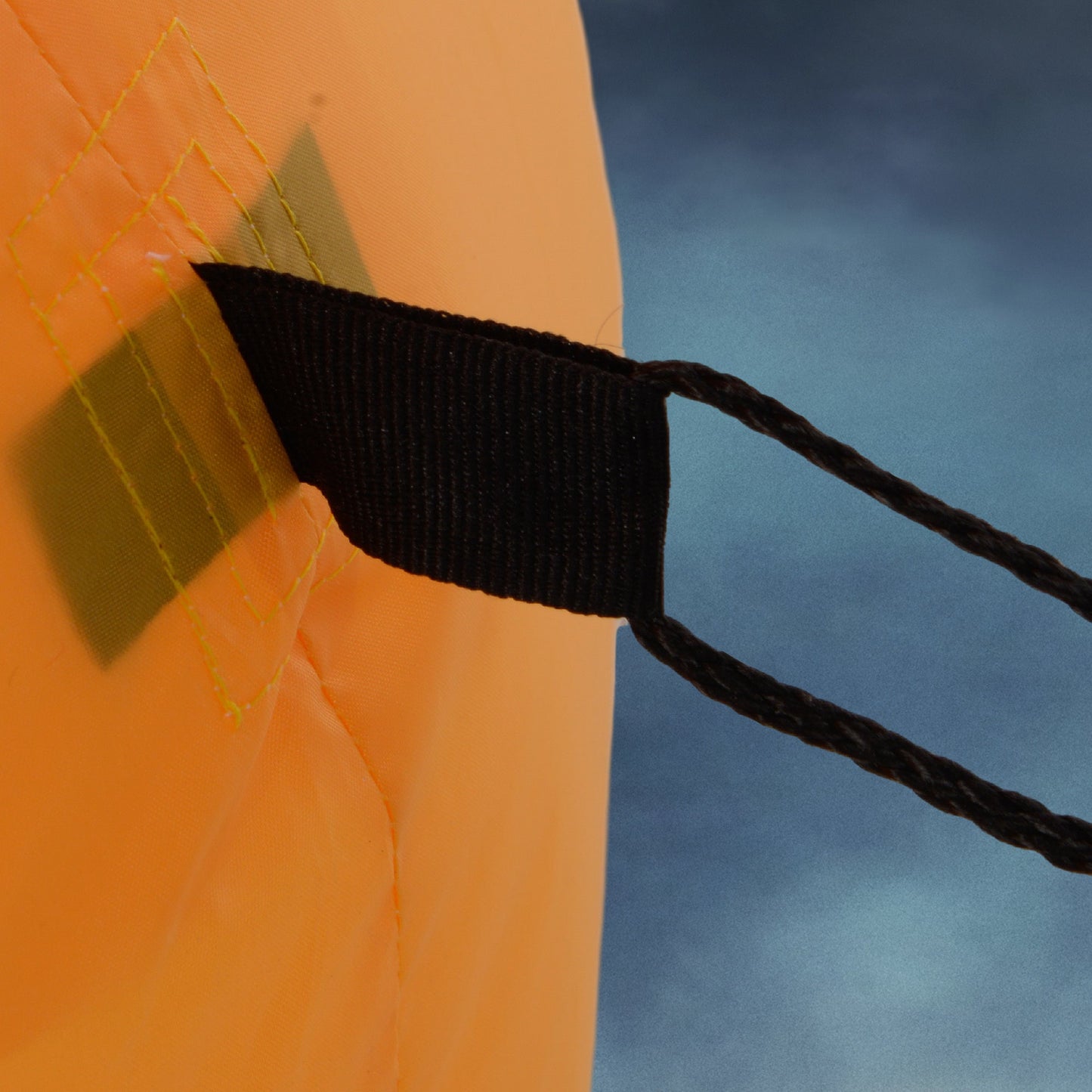 5-Foot Halloween Inflatable close-up: orange fabric, yellow stitching, black strap on Tampa Home & Garden Store