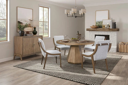 Elegant Round Dining Table with a wooden pedestal base in a modern dining room on Tampa Home & Garden Store