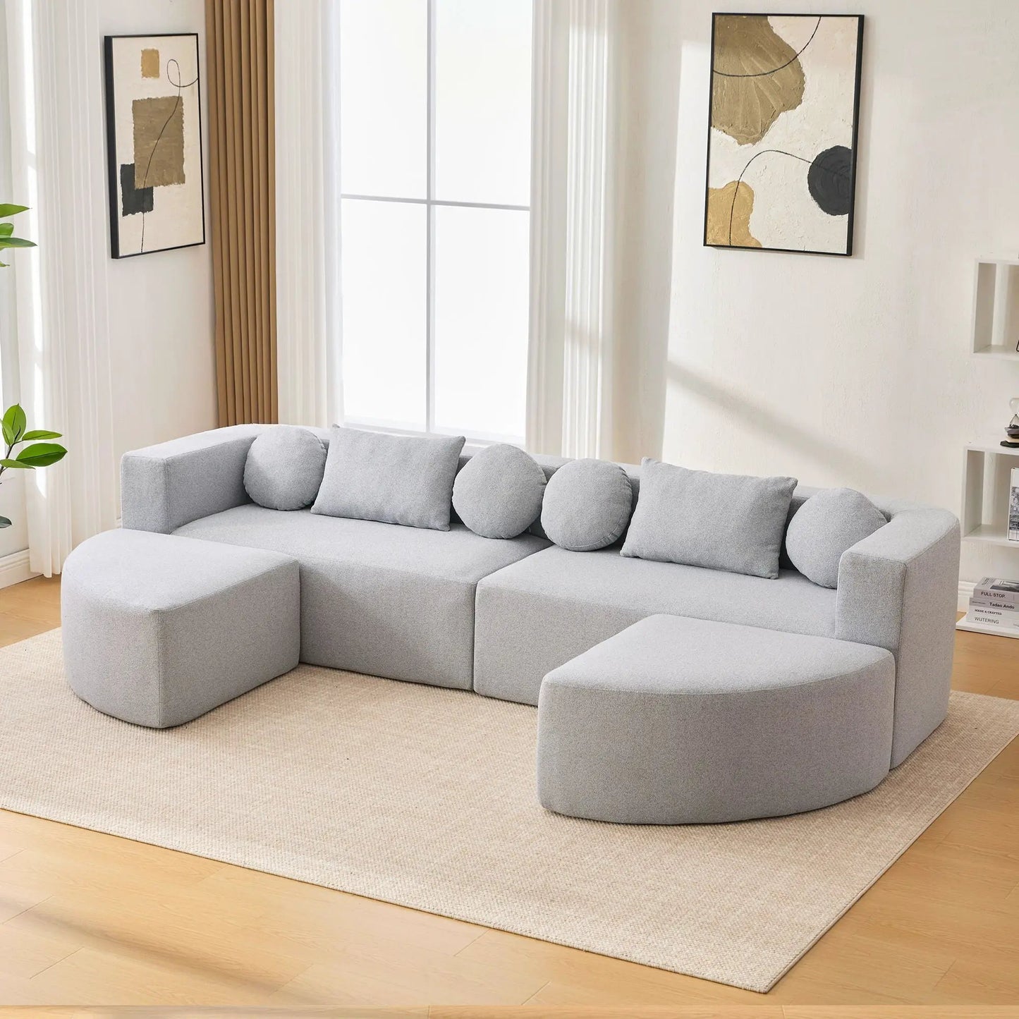 Boneless couch modular sectional sofa in light gray fabric with deep seating and curved design on Tampa Home & Garden Store