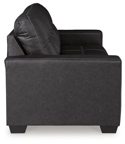 Barlin Mills black leather stationary sofa by Unique Piece Furniture with white contrast stitching on Tampa Home & Garden Store