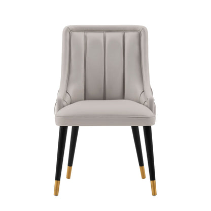 Eda dining chair with stitched gray upholstery, black legs with gold tips by HouseOfZazla on Tampa Home & Garden Store