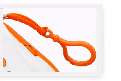 Orange baby pacifier clip with braided cord and loop attachment close-up on Tampa Home & Garden Store