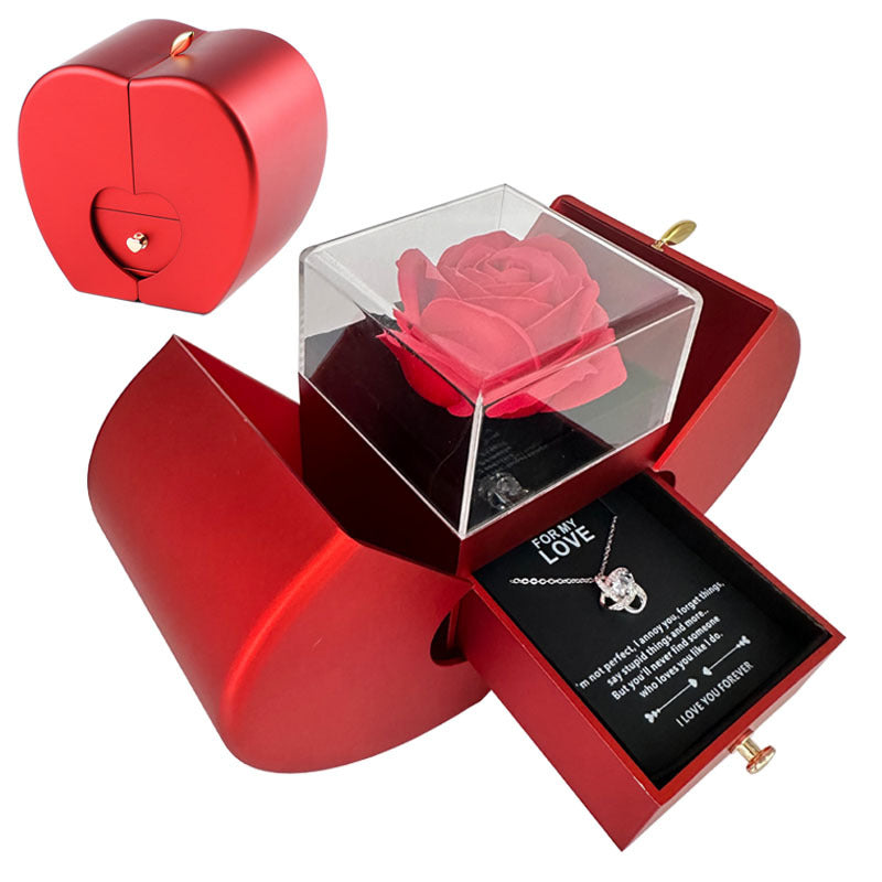 Red apple jewelry box with heart clasp opens to reveal a crystal pendant necklace and rose on Tampa Home & Garden Store