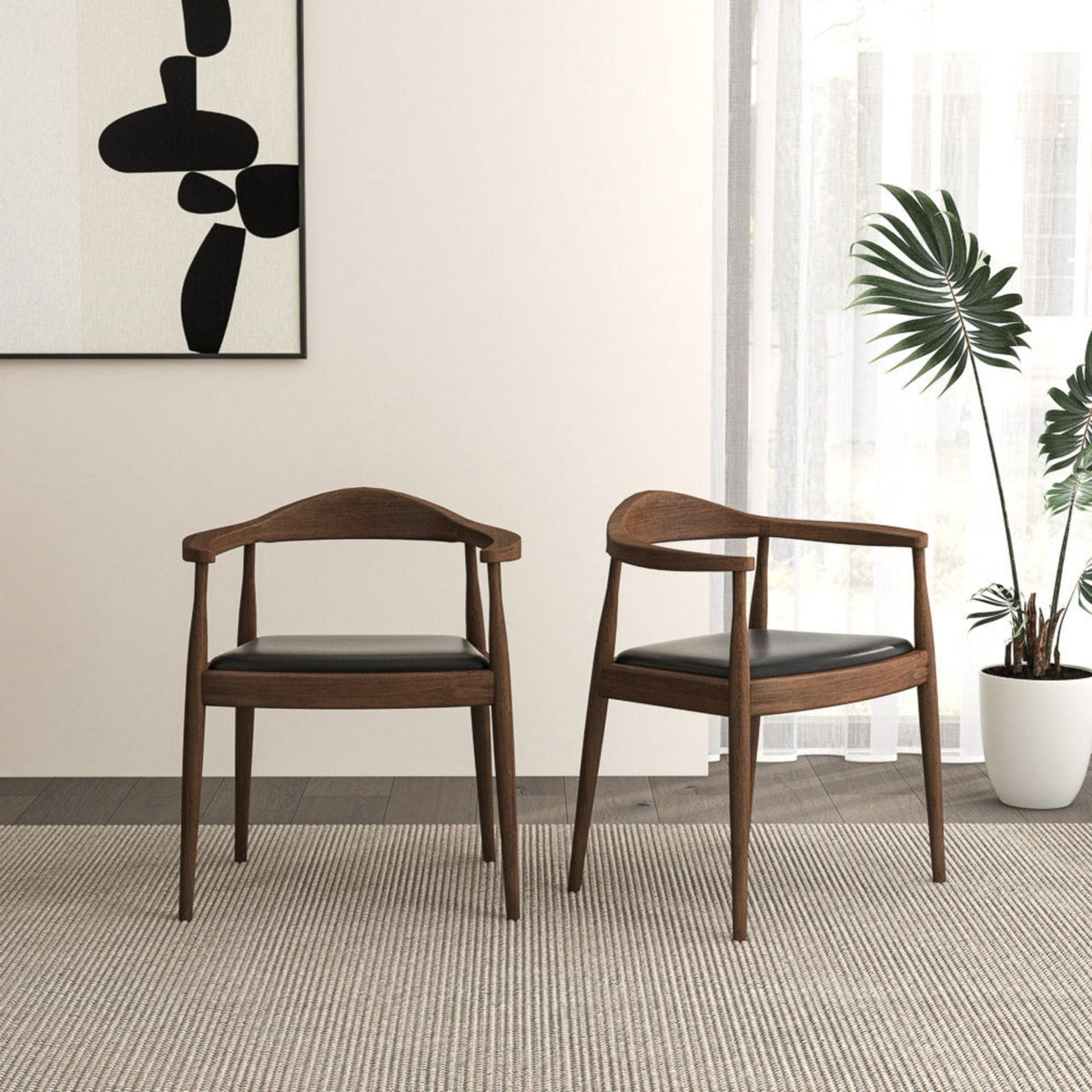 HouseOfZazla mid-century modern dining armchairs with dark brown wood frames and black cushions on Tampa Home & Garden Store