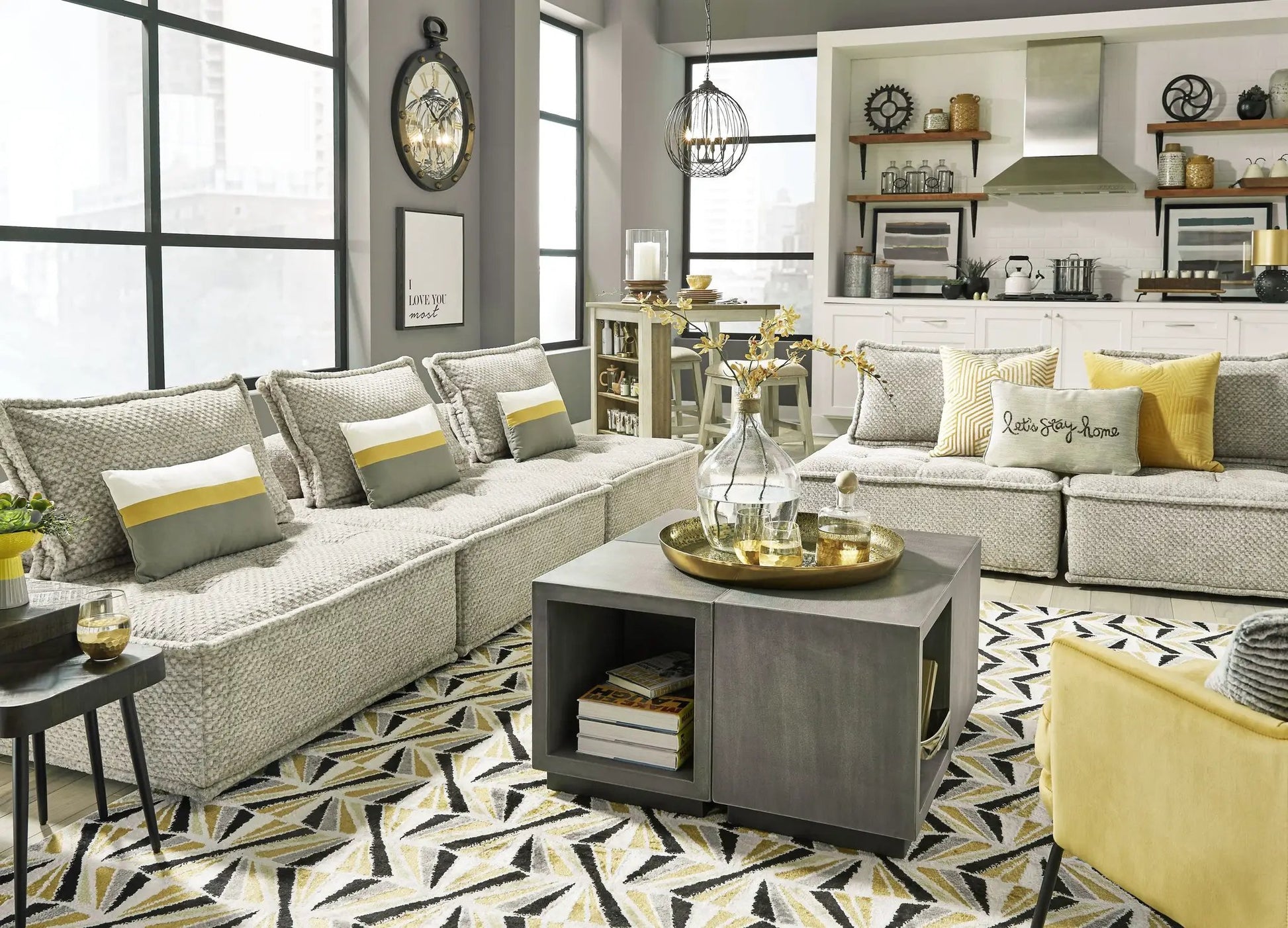 Bales Sectional sofa in light gray textured fabric with yellow pillows by Unique Piece Furniture on Tampa Home & Garden Store