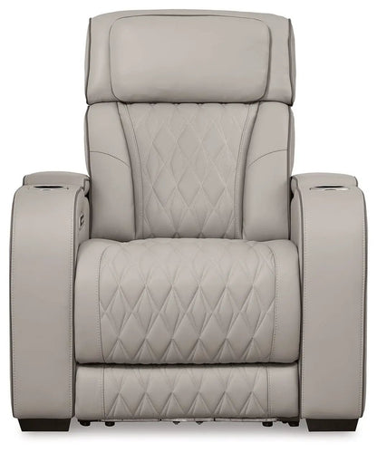 Boyington power recliner with adj headrest in taupe leather, quilted finish, cup holders on arms on Tampa Home & Garden Store