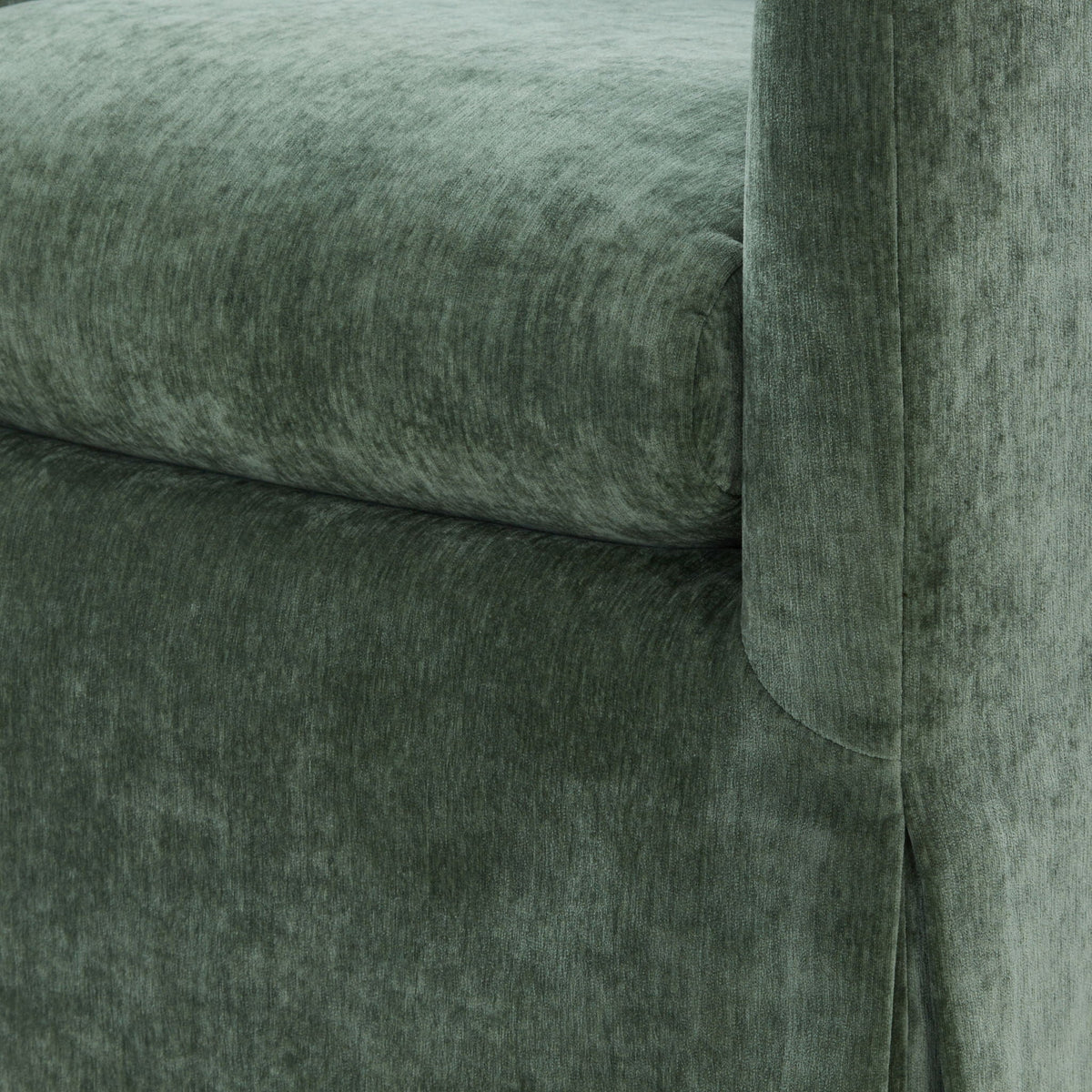 Skirted swivel accent chair fabric close-up in dark green velvet with tufting on Tampa Home & Garden Store