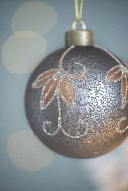 Christmas ball ornament with metallic grey finish and silver glitter floral scrolls on Tampa Home & Garden Store